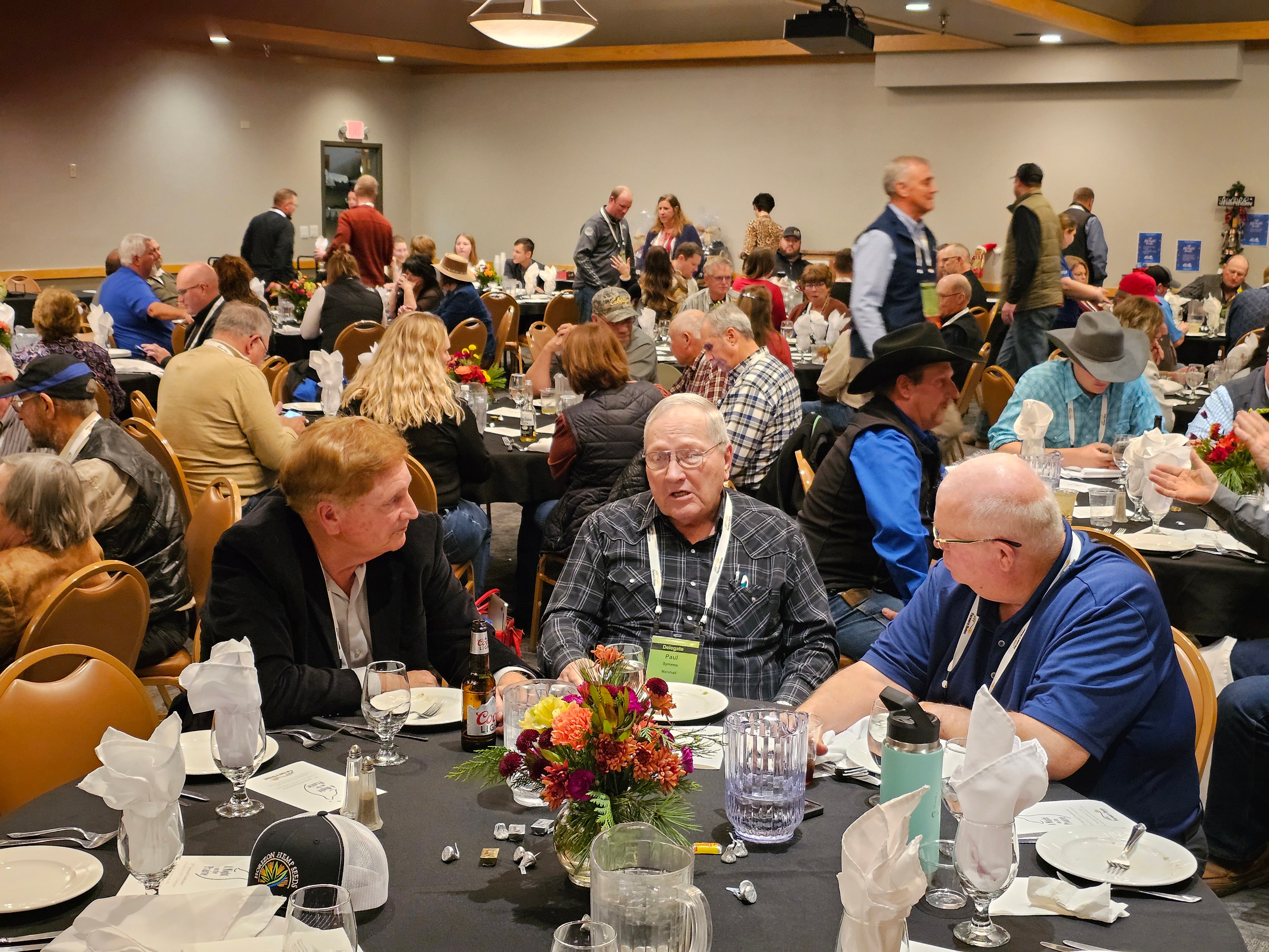 Wide view of the banquet room filled with guests