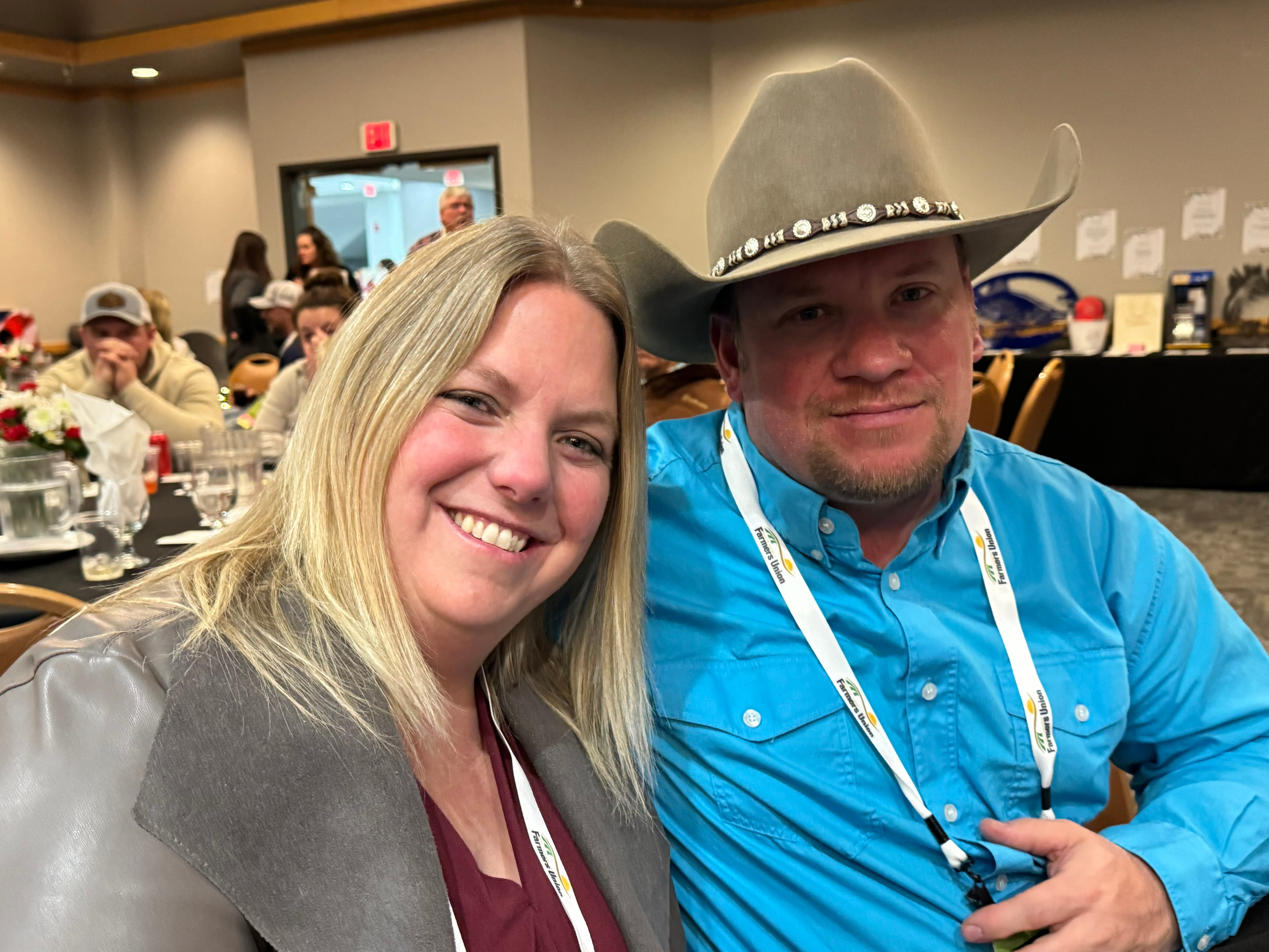 Couple at the event, man wearing a cowboy hat
